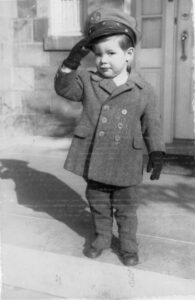 Borden as a young boy wearing a pilot's cap