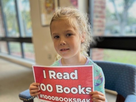 Cora has read 100 books.